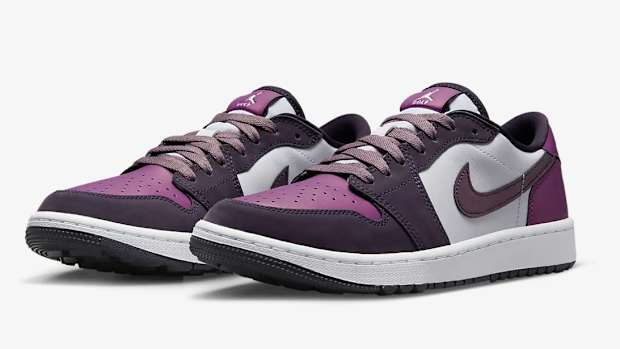 View of purple and white Jordan shoes.